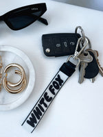 White Fox Next Level Strap Keychain Black